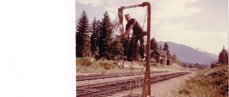 Carl Bertholm Hangs Last Mailbag To Be picked Up By Train